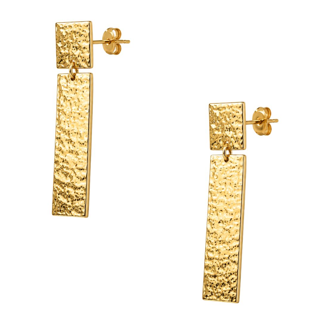 Gold hammered dangle earrings on white