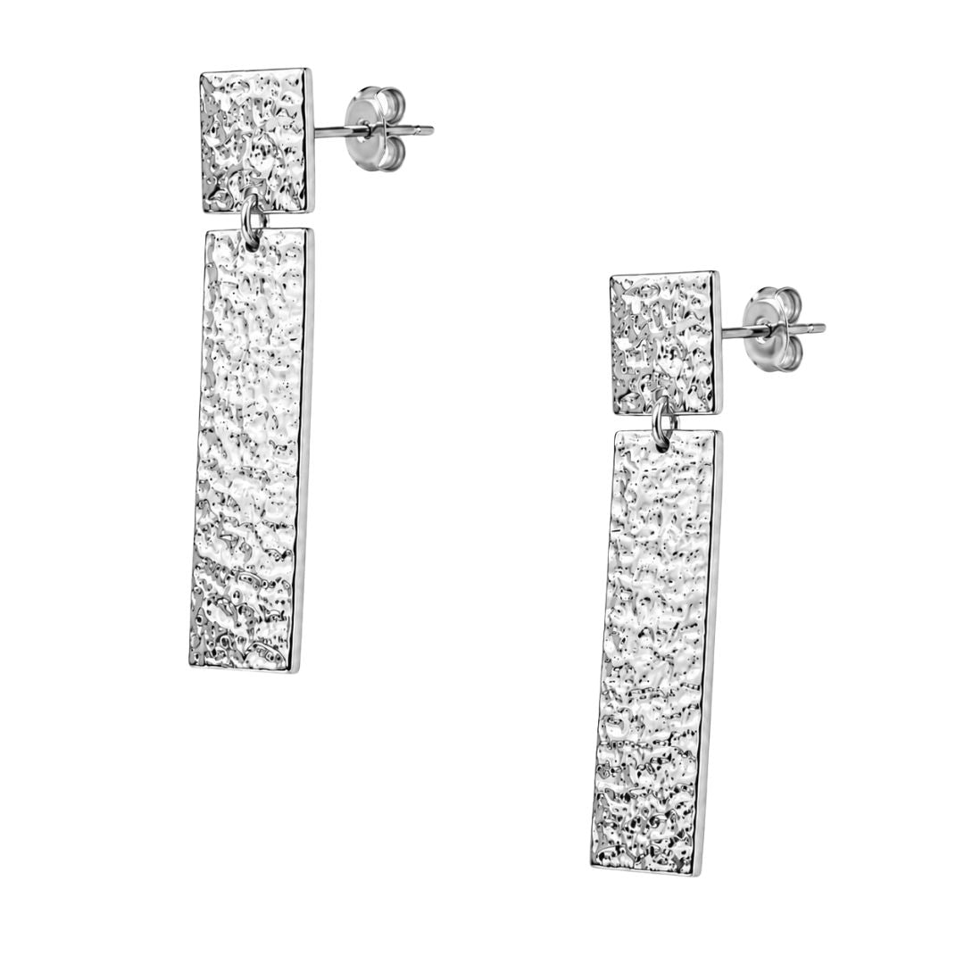Silver hammered drop earrings on white